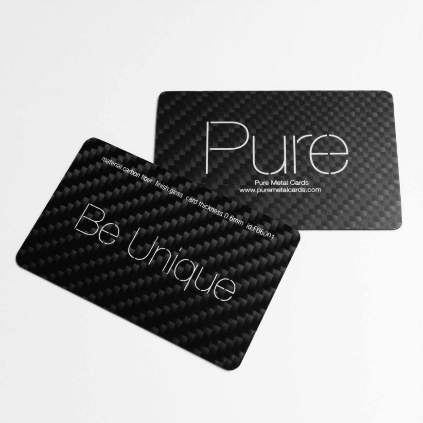Two black carbon fiber business cards; one says "Pure" and the other "Be Unique".