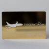 gold-plated Gold frequent flyer card with airplane cutout. Eric Fabery de Jonge, 12345678, Valid 12/15.