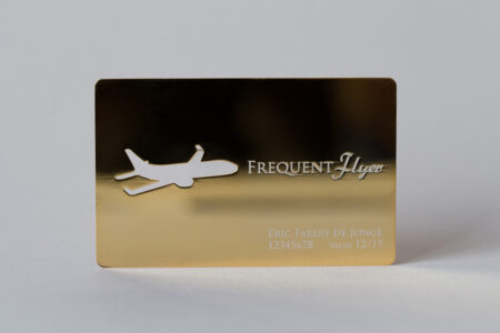 Gold frequent flyer card with airplane cutout. Eric Fabery de Jonge, 12345678, Valid 12/15.