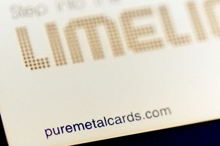 Close-up of a brass mirror card; puremetalcards.com