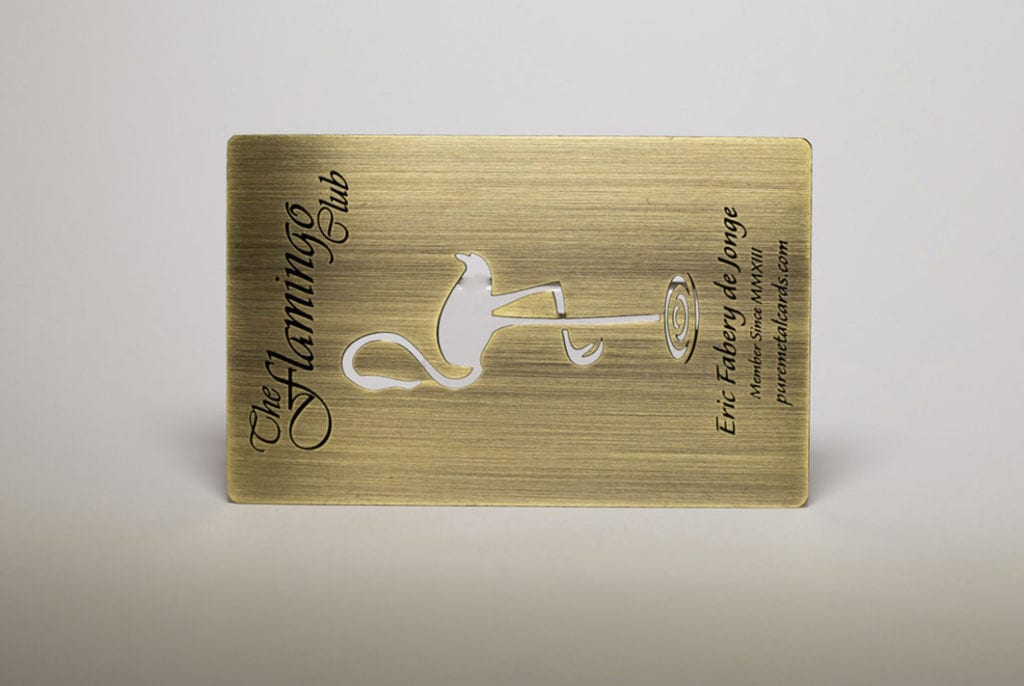 Antique brass business card featuring The Flamingo Club logo.