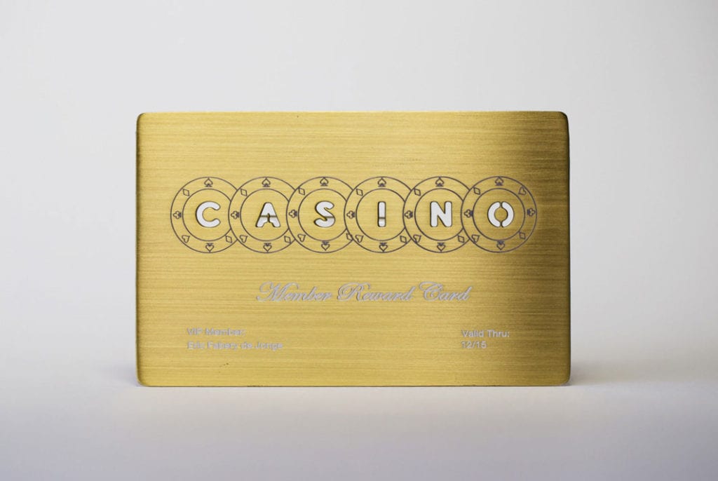 Gold brushed metal casino reward card. "CASINO" is cut out of the card.