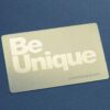 pure-metal-cards-brass-gold-prism-card-4 Gold metal card with "Be Unique" text. Brass prism card example.