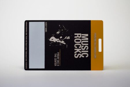 Matt black frosted stainless steel card featuring "Music Rocks" and event details.