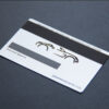 Silver plated metal business card with a car graphic and "Authorized Signatory" text.
