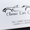 Close-up of a silver-plated Classic Car Club membership card.