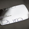 sterling-silver-3 Close-up of a sleek silver business card with "Pure" engraved.