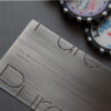 Brushed stainless steel business card with website address: www.puremetalcards.com