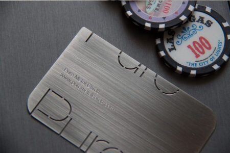 Brushed stainless steel business card with website address: www.puremetalcards.com