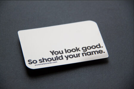 Sleek mirror stainless steel business card with the text: "You look good. So should your name." Puremetalcards.com