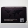 Matt black stainless steel card with embossed world map and QR code.
