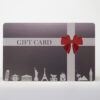 standard-stainless-steel-3 Gift card design: dark gray stainless steel card with red bow and world landmarks. "GIFT CARD