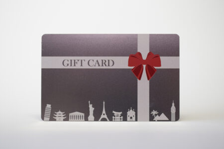 standard-stainless-steel-3 Gift card design: dark gray stainless steel card with red bow and world landmarks. "GIFT CARD