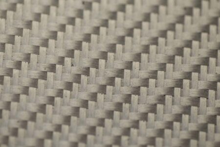 Close-up of silver glass fiber fabric weave.