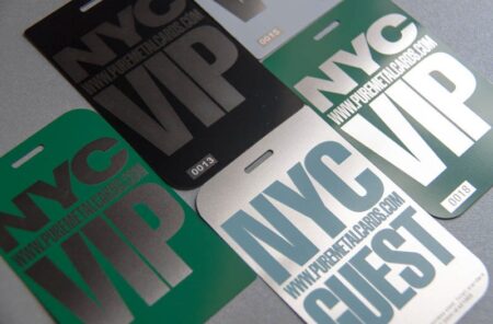 2 NYC VIP passes and guest passes; metallic, engraved designs.