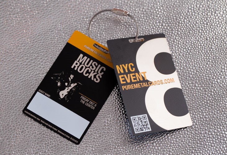 Two VIP passes with metallic finishes; one for a music event, one for a NYC event.