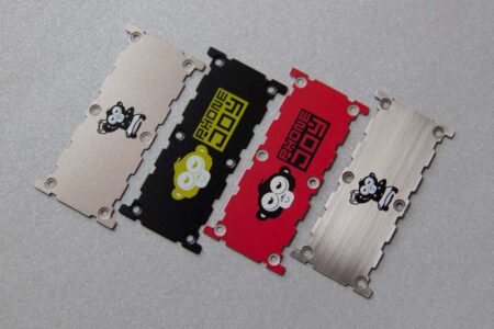 Four metal plates showcasing precision engineering; each features a unique design and Phone Joy logo.