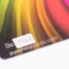 2 Close-up of metallic full color business cards; "Be Unique" and puremetalcards.com