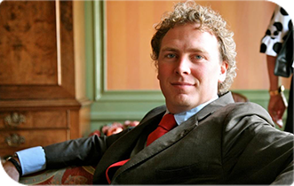 Friendly man in suit, available for contact.