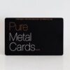 Pure_Metal_Cards_matt_black_contour_copper_card_IMG_8875 Matt black contour copper business card with "Pure Metal Cards.com" text.