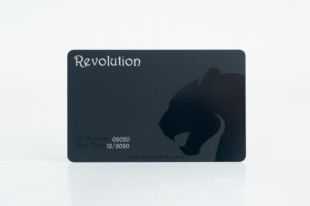 Matt black titanium business card with "Revolution" and panther design. Valid through 12/2020.