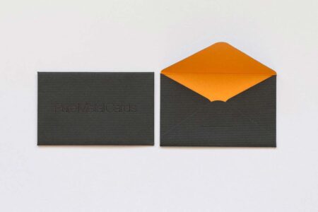 Dark gray luxury envelope with orange interior liner; PureMetalCards