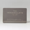 Brushed titanium membership card for The Immaculate Club, member Amber Sloane #001 of 100.