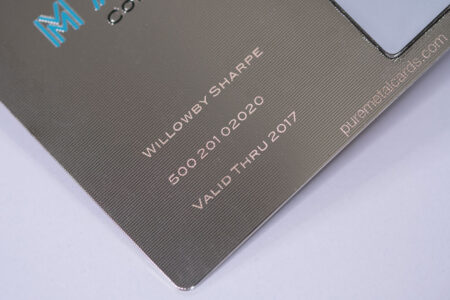 Close-up of a silver contour metal card, showing the text "Willowby Sharpe," "5000 20102020," and "Valid Thru 2017.