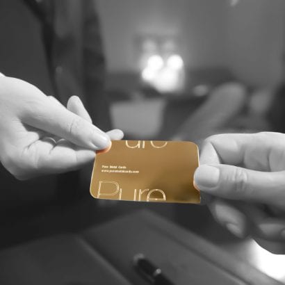 pure-metal-cards pure gold cards with hands holding the card