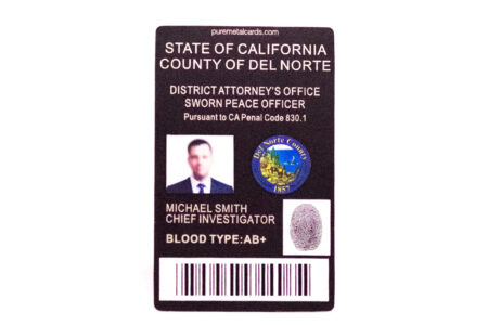 Metal ID badge for Michael Smith, Chief Investigator, Del Norte County District Attorney's Office.