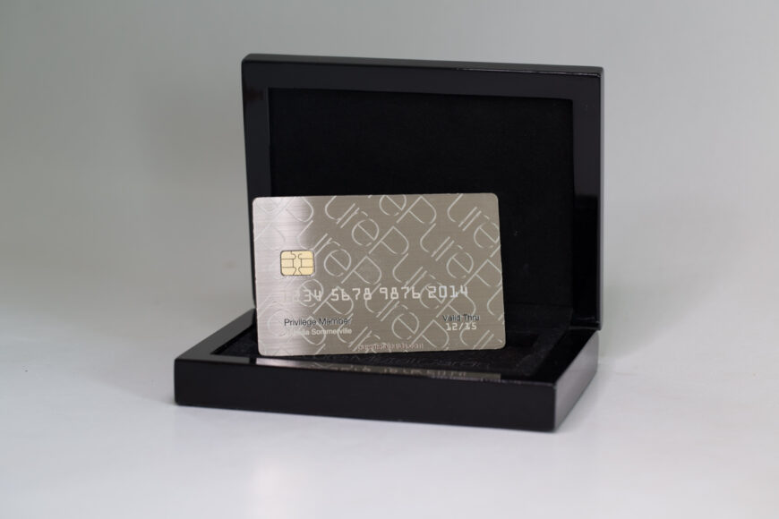 Luxury metal business card in sleek black packaging.