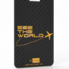 Pure-Metal-Cards_Carbon-Fiber-Luggage-Tag_Front_V02_1-1 Black carbon fiber luggage tag with gold "See the World" text and airplane graphic.