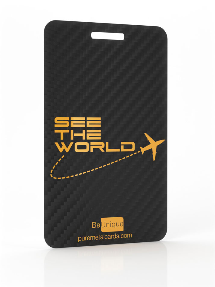 Black carbon fiber luggage tag with gold "See the World" text and airplane graphic.