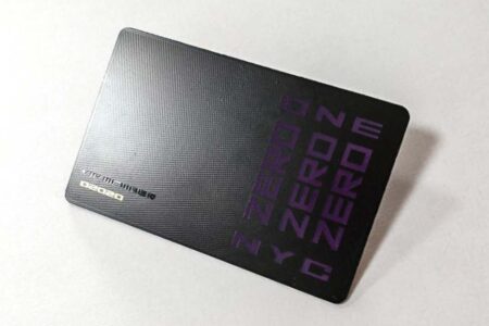 Matt black pixel stainless steel card with "ZERO ONE NYC" branding.