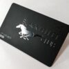 Matt black velvet stainless steel card with silver embossed horse and "The Black Velvet Club" text.