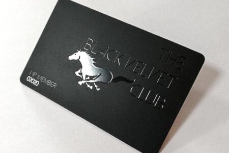 Matt black velvet stainless steel card with silver embossed horse and "The Black Velvet Club" text.