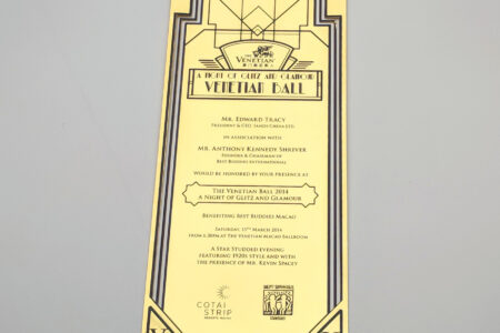 Elegant gold Venetian Ball invitation, featuring Art Deco design. Metal invitation cards for a special event.