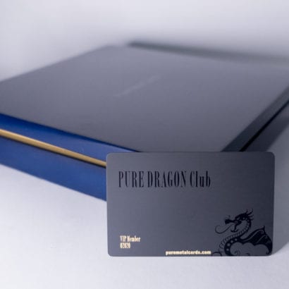Black velvet metal card in navy blue box. "Pure Dragon Club" is printed on the card.