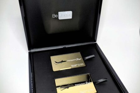 Luxury black wood presentation case with gold Frequent Flyer cards.