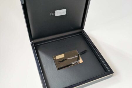 Luxury wooden presentation case with gold Frequent Flyer card inside. "Be Unique