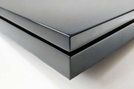 Close-up of a sleek, black wood presentation case.