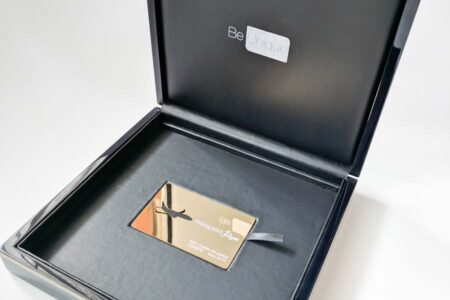 Luxury wood presentation case with gold Frequent Flyer card inside.