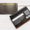 Gunmetal gray metal card featuring "Velocity Cyclo" and member name.