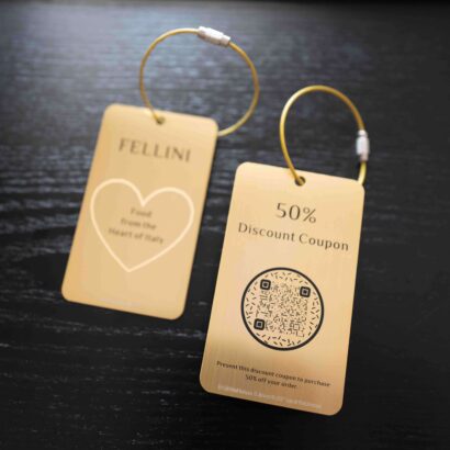 Two premium metal cards with discount offers from Fellini, showcasing a 50% discount coupon and brand logo.