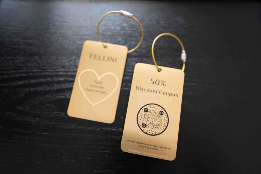 Two premium metal cards with discount offers from Fellini, showcasing a 50% discount coupon and brand logo.