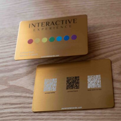 Gold metal business cards showing interactive experience, QR code options: printed white, black, laser etch. puremetalcards.com