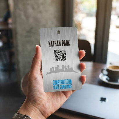 Metal badge for ConstructCon Trade Conference with QR code and attendee name, Nathan Park. Metal ID Badge by Pure Metal Cards