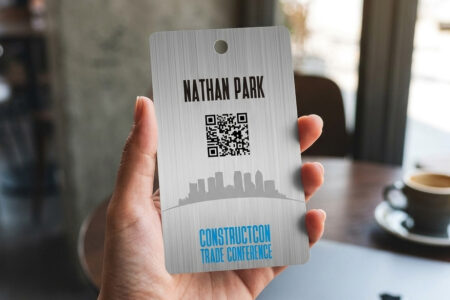 Metal badge for ConstructCon Trade Conference with QR code and attendee name, Nathan Park. Metal ID Badge by Pure Metal Cards