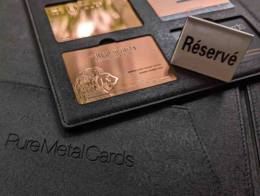 Luxury copper cards in a black case. "Réservé" and "Purely Spirits" are visible.