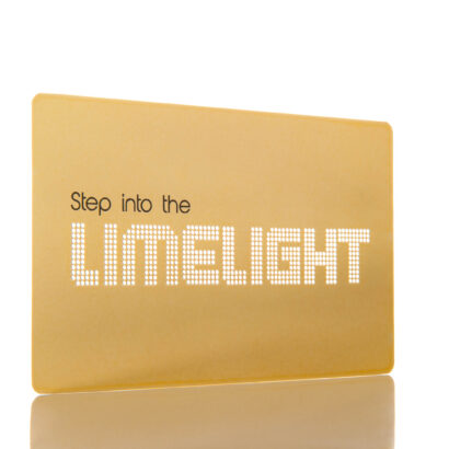 Gold metal business card with "Step into the LIMELIGHT" text. A metal business card size example.
